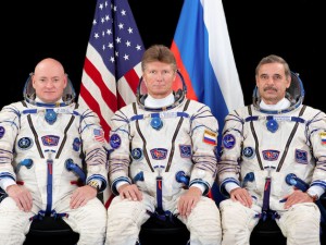 Russian and American Cosmonauts sit side by side