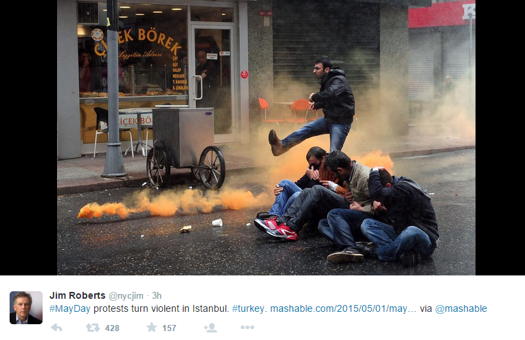 Protester kicks tear gas can